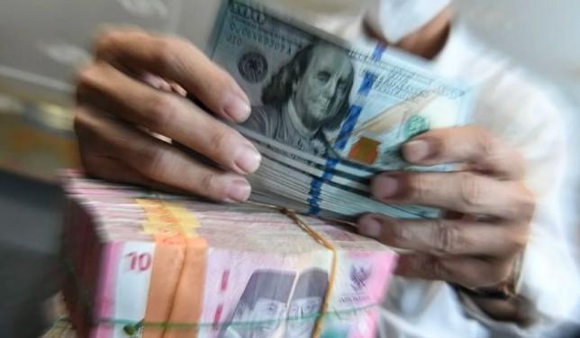 Rupiah Melemah ke Rp16.302 per Dolar AS, Dipicu Sikap S&P dan Antisipasi Pidato The Fed