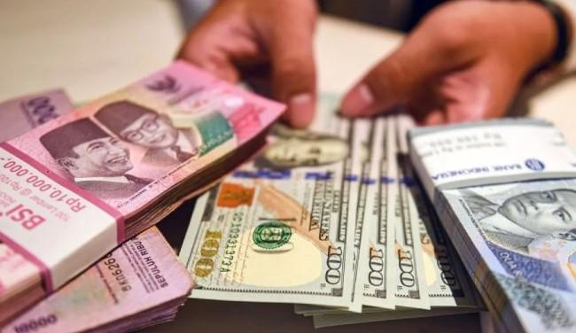 Rupiah Melemah ke Rp16.873 per Dolar AS Dipicu Sikap Hawkish The Fed