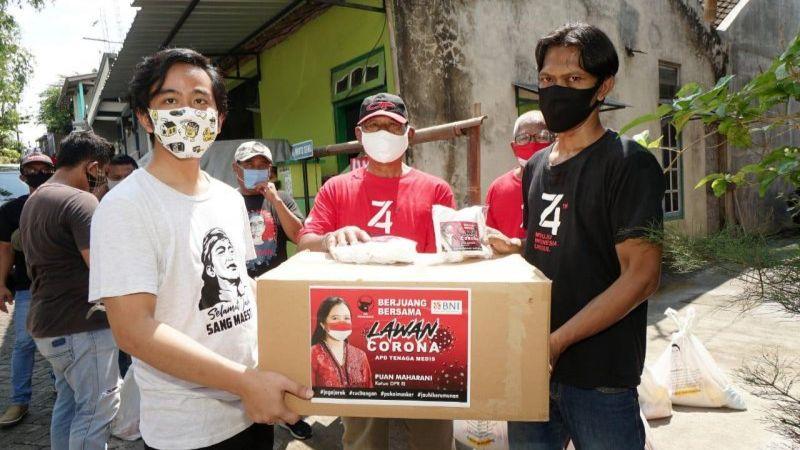 Gibran Salurkan Bantuan Ribuan Masker dari Puan Maharani ke Masyarakat Solo